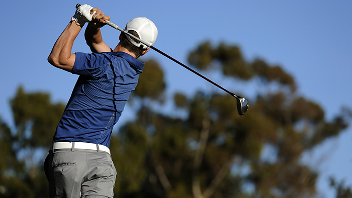 Golfer in blue shirt