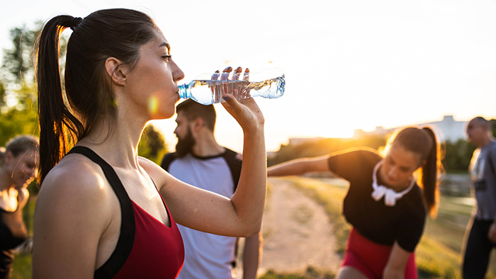 Woman drinking a bottle of water 