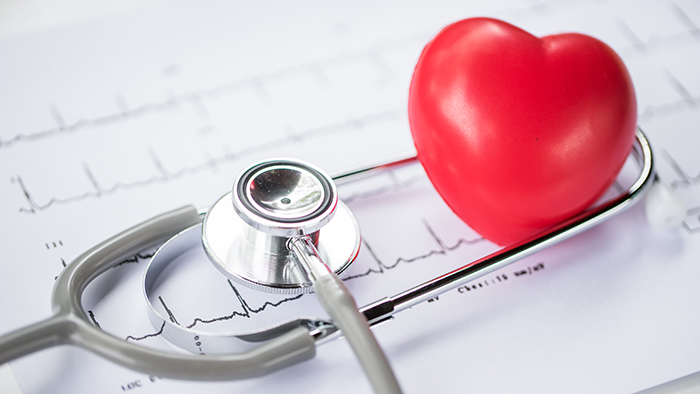 Stethoscope wrapped around heart on EKG reading