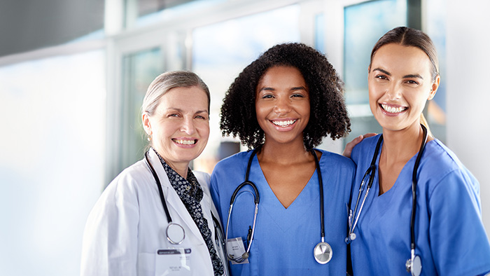 Nurses and Doctors interacting and smiling