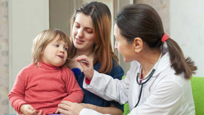 Young child with mom and home care nurse