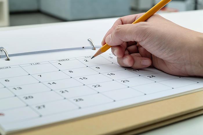 writing down date on calendar