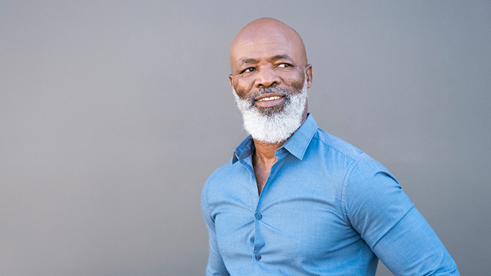Middle-aged African-American man in a blue shirt. 
