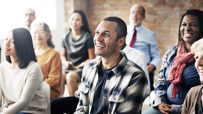 A room full of people at a support group