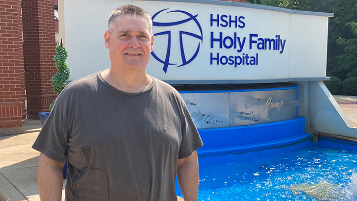 Gary McKee in front of HSH Holy Family Hospital