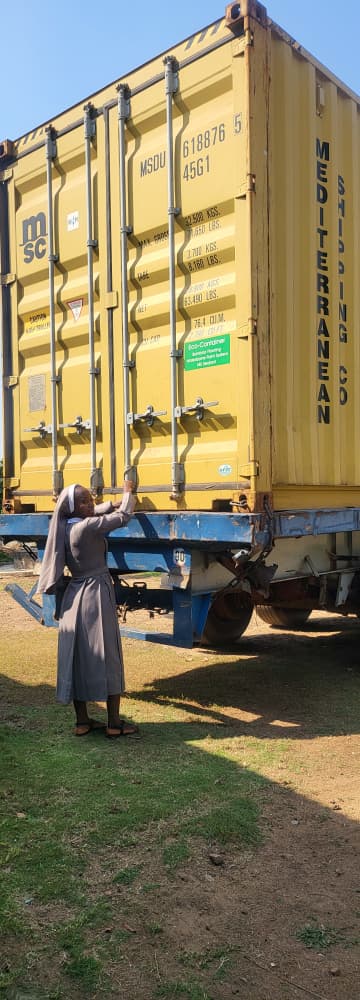 Nun opening a container of medical equipment
