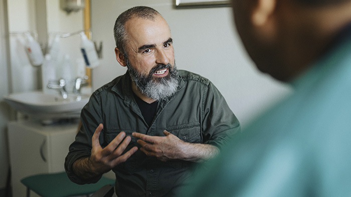 male patient talking with doctor