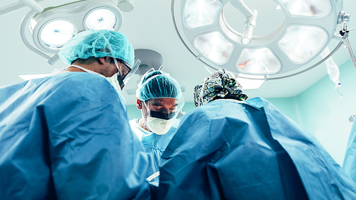 doctors performing surgery in operating room