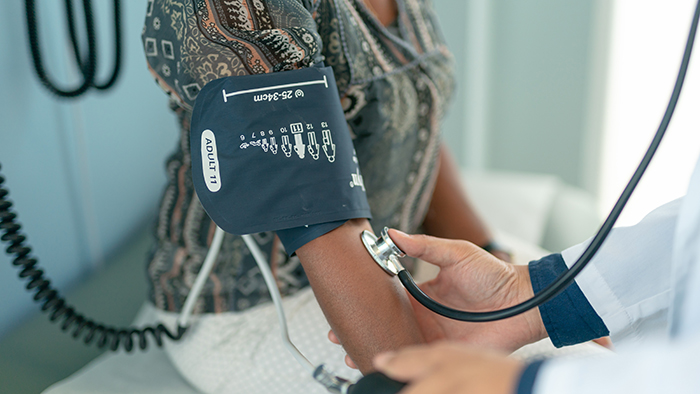 Taking blood pressure in a doctors office