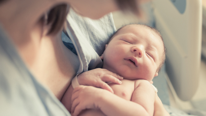 Infant in her mother's arms