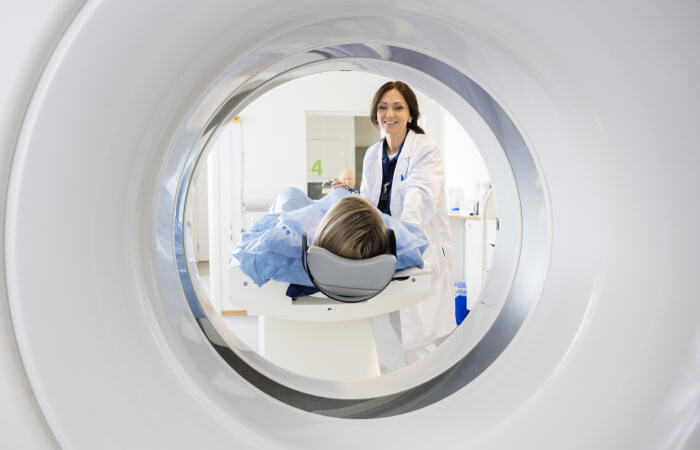 Patient moving a patient into CT machine