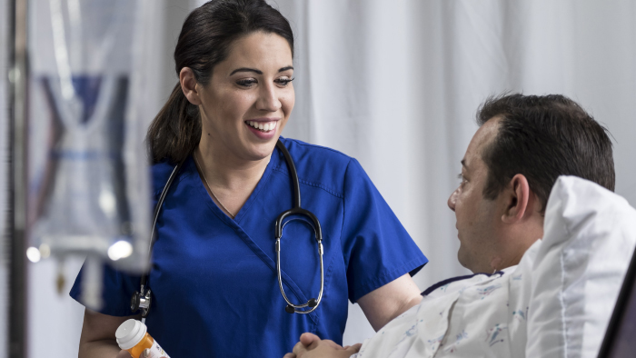 Young female nurse with male patient