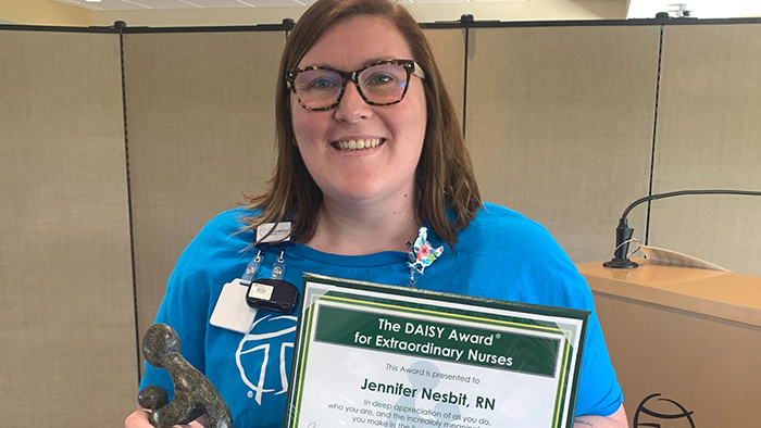 Jennifer Nesbit, RN with DAISY award certificate