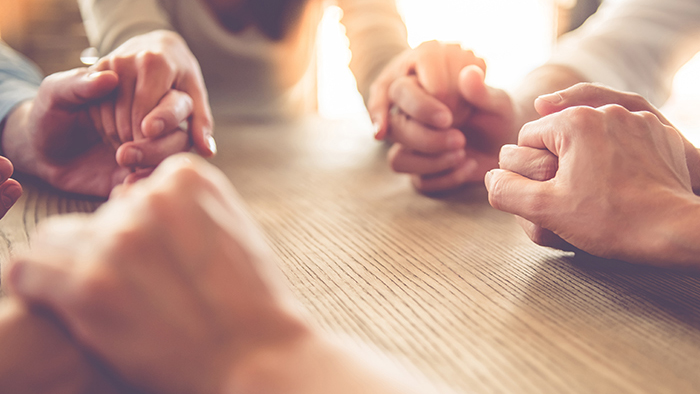 A circle of women holding hands