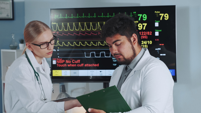 Two physicians looking at scan results