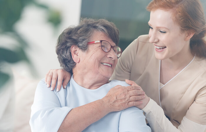 Young woman hugging an older woman