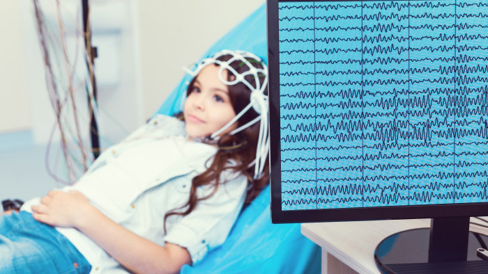 Young girl receiving an EEG study