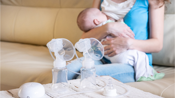 Breastfeeding mom with breast pump supplies