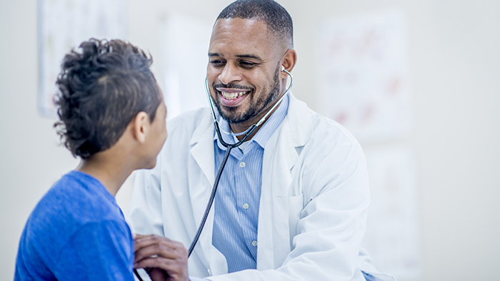 Male cardiologist consulting with a female patient