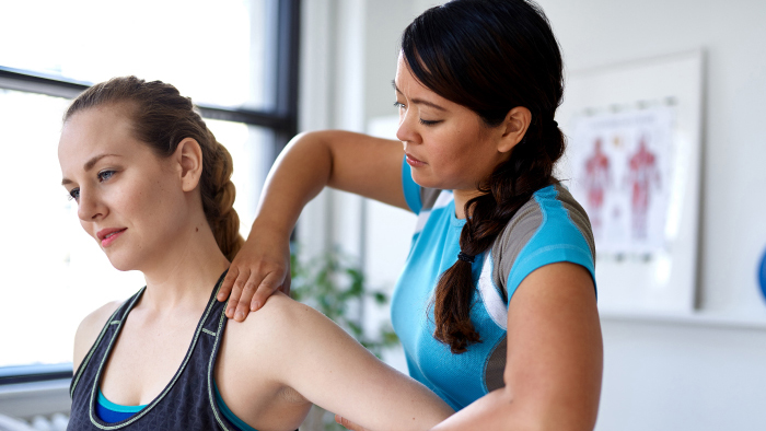 Female therapist working on female athlete