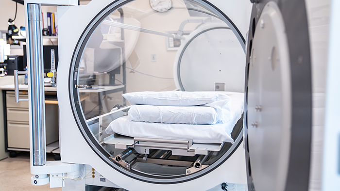 Young woman in hyperbaric oxygen chamber