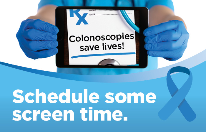 A provider holds up a tablet that says colonoscopies save lives!