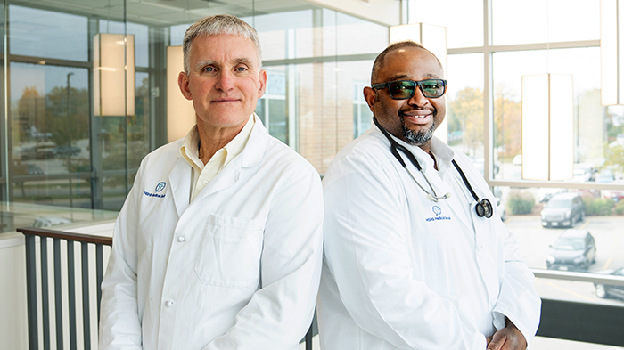 Two male surgeons posing for a photo at St. Mary's Hospital