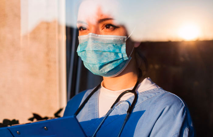 Female medical professional wearing mask