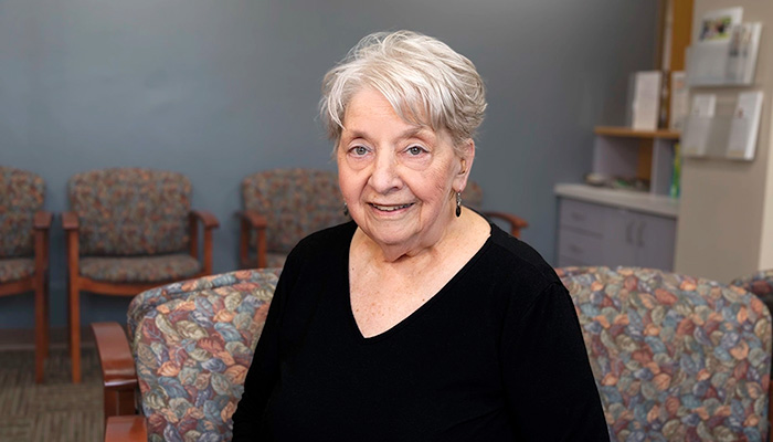Patient Nancy smiling at the camera