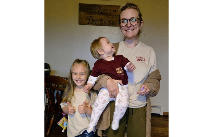 Courtney's sister and nieces model the apparel they purchased to help cover medical costs.