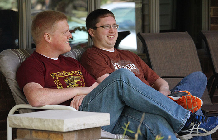 Michael sitting in a chair outside