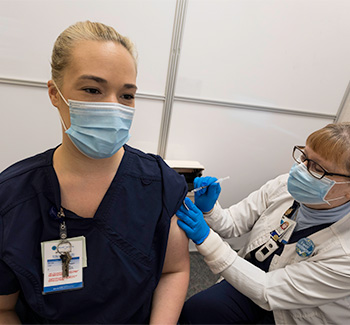Nurse Kayla Kennedy receiving second dose of COVID-19 vaccine