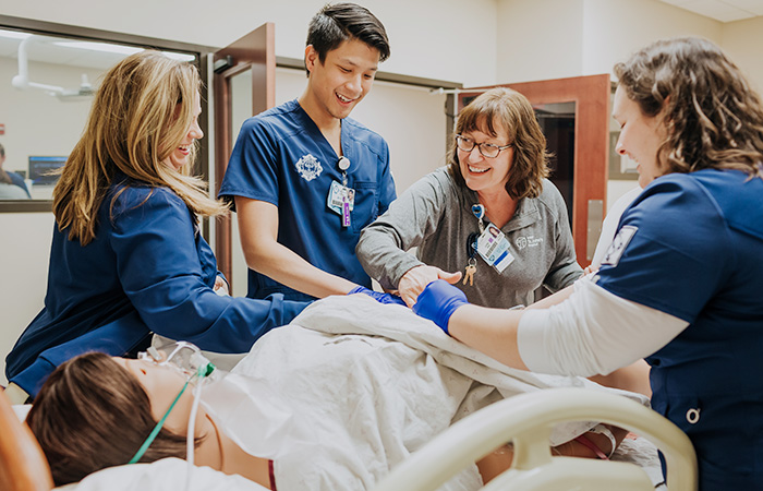 Students in simulation lab with instructor