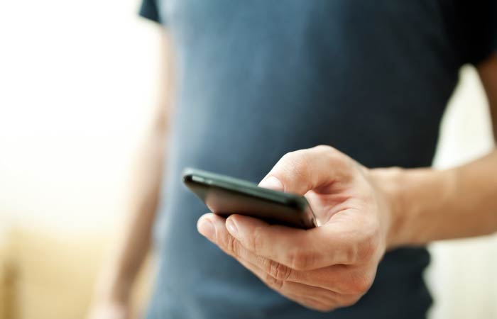man holding cell phone