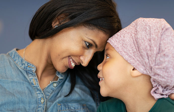 Black woman with child cancer patient