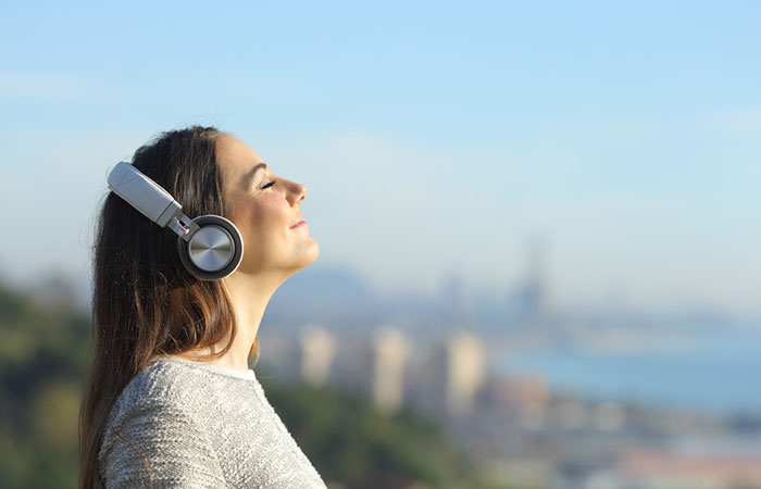 Women listening to music with headphones
