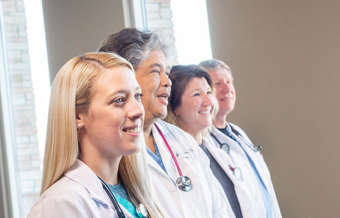 St. Joseph Highland - Group of doctors standing in a line smiling