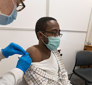 Dr. Richard Amankwah receiving second dose of COVID-19 vaccine
