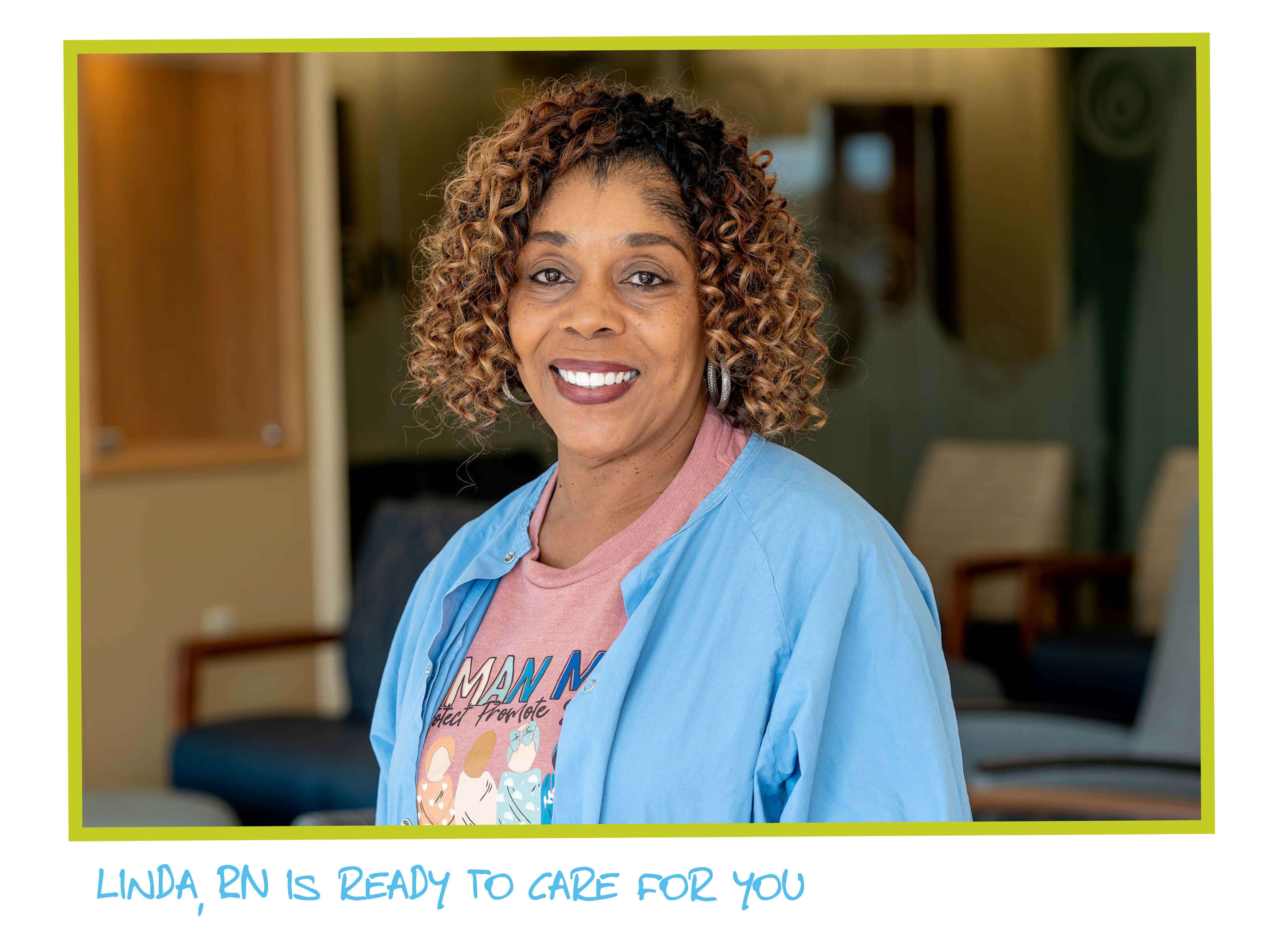 A woman smiling wearing scrubs