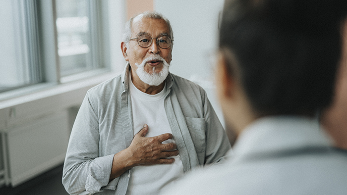 Blog-PatientSpeakingWithDoctorTouchingChest.jpg