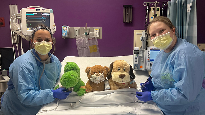 Pediatric team members at HSHS St. John’s Children’s Hospital examine patients in preparation for a “teddy bear clinic”
