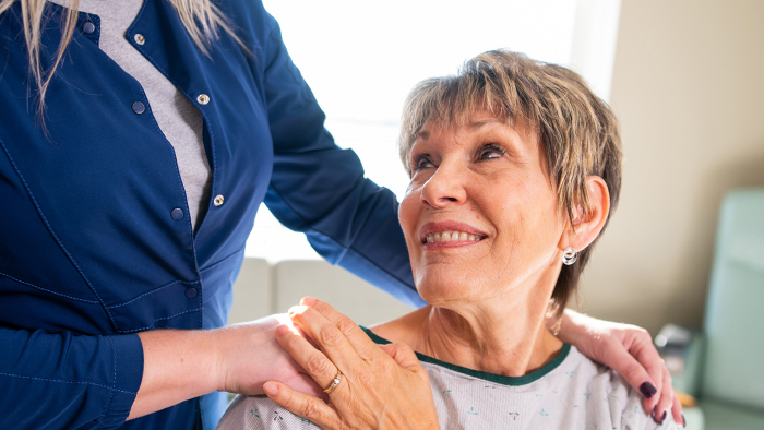 Woman patient looking up at care professional