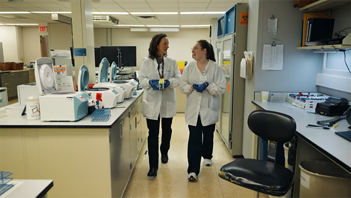 two HSHS colleagues talking in the lab