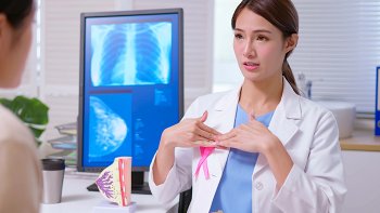 Mammography technician and patient