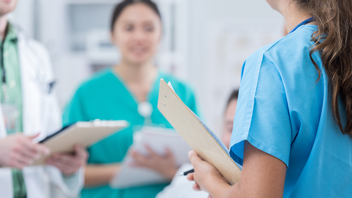 Nursing students with clipboards