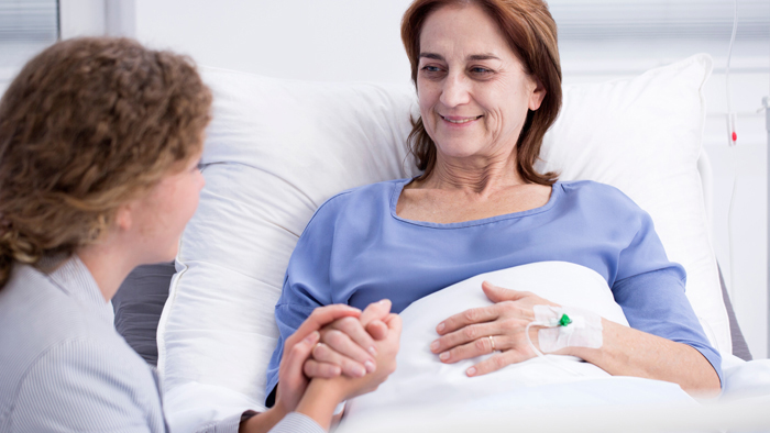 Case management talking with female patient