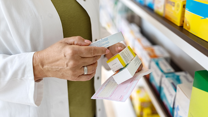 pharmacist holding medications