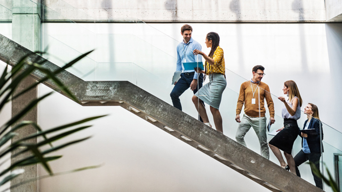 young professionals on a staircase in building