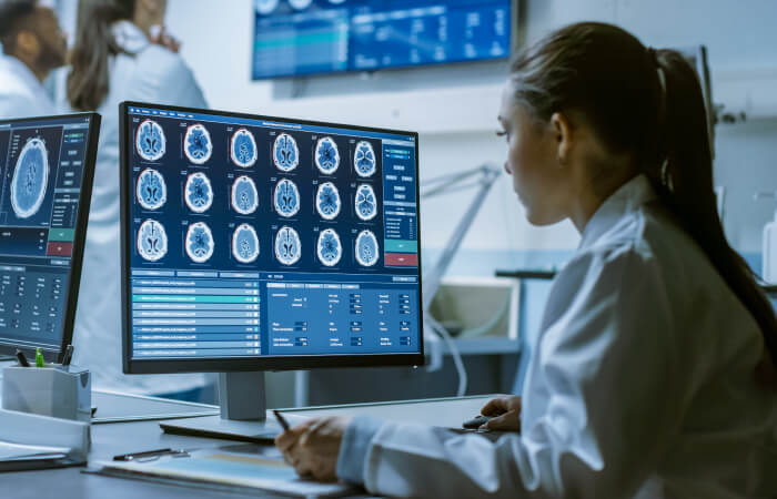 Female provider reviewing neuroscience imaging 