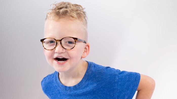 Jude with hands on his hips smiling